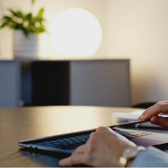 Man reading The 7-Day Procrastination Detox ebook at a desk on a laptop