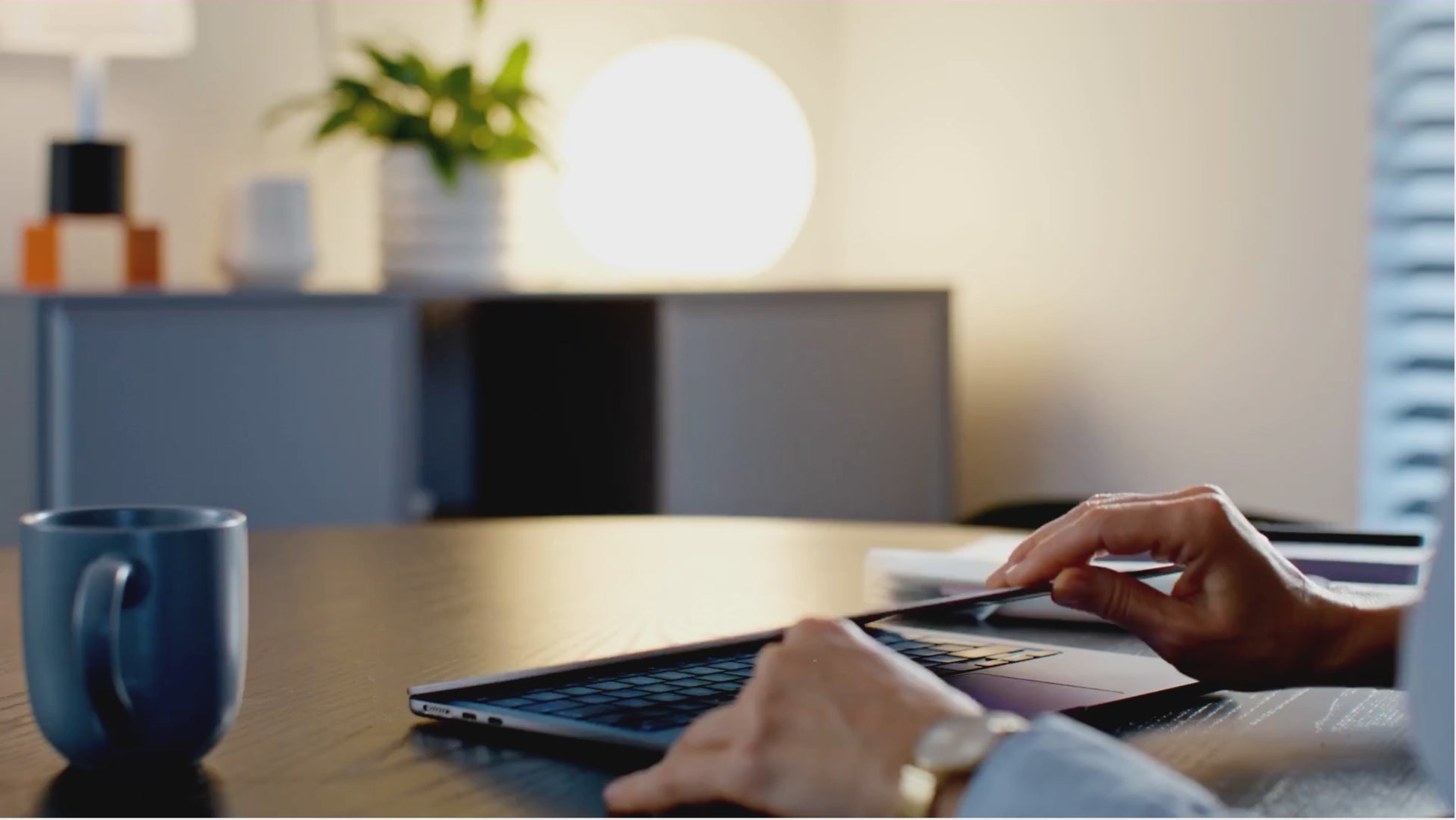Man reading The 7-Day Procrastination Detox ebook at a desk on a laptop