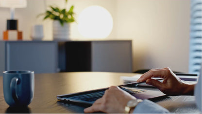 Man reading The 7-Day Procrastination Detox ebook at a desk on a laptop
